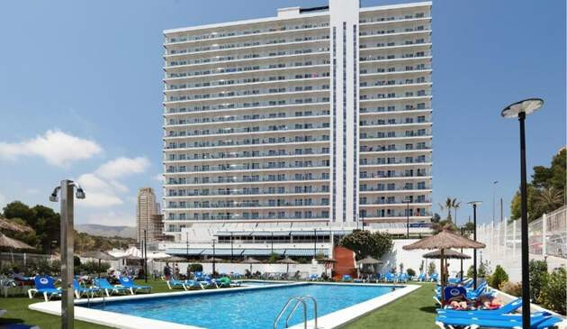 Picture of Hotel Poseidon from outside, including outdoor swimming pool.