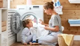 A mother and daughter doing laundry together