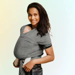 Woman wearing Izmi Essential baby wrap with baby inside