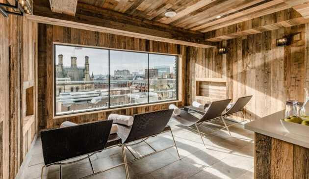 Relaxing chairs overlooking Manchester from King Street Townhouse