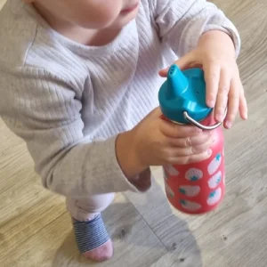 Child holding Klean Kanteen Kid Classic Sippy Cup