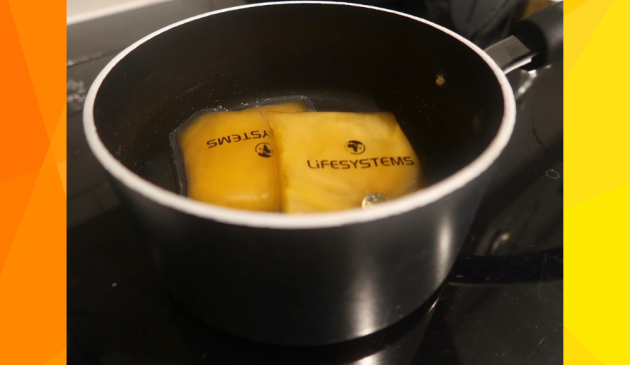 Lifesystems Reusable Hand Warmers being boiled to recharge