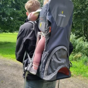 Man carrying toddler in Littlelife Cross Country S4 carrier