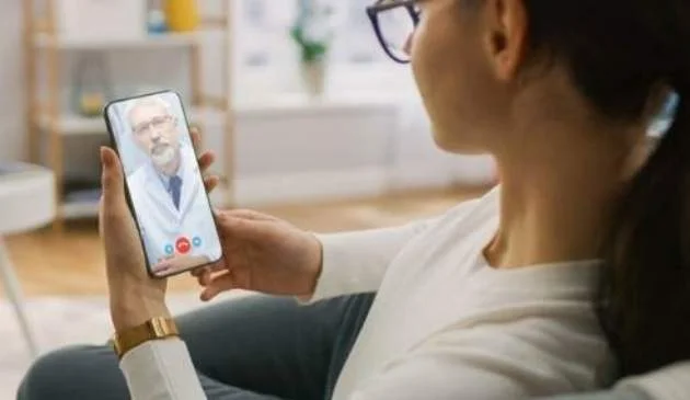 woman talking to doctor over video call
