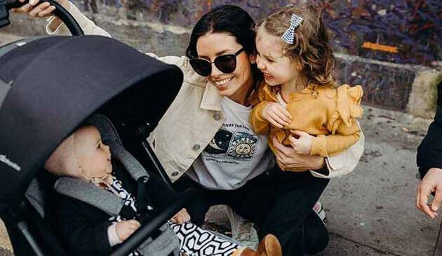 micralite profold buggy with child inside