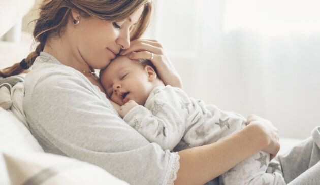 mother hugging baby