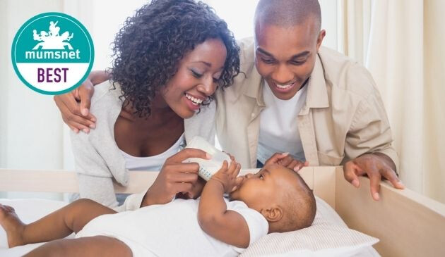 parents bottle feeding baby