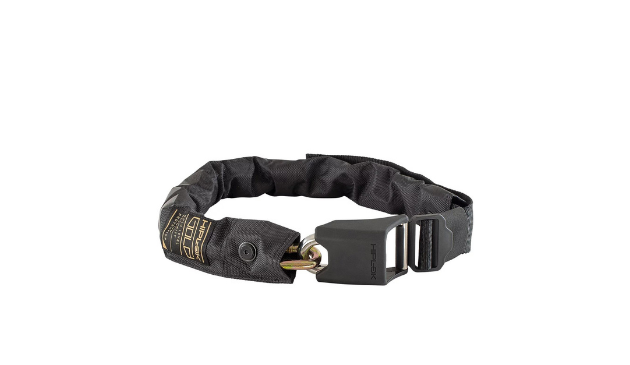 a gold Hiplok chain with a black fabric cover