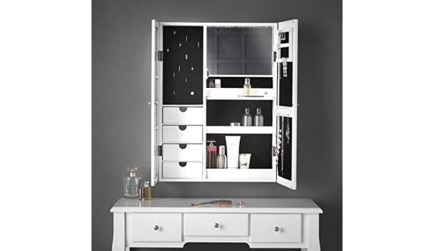 a white jewellery cabinet hung on a wall