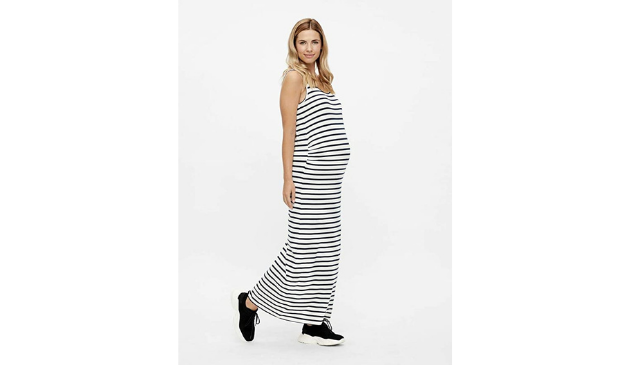 a woman wearing a long stripy dress