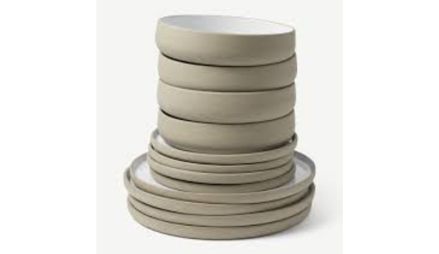 a stack of neutral coloured bowls and plates