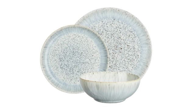 two pale blue speckled plates and a bowl