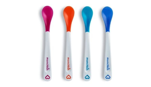 Four Munchkin White Hot Infant Safety Spoons with white handles and coloured ends