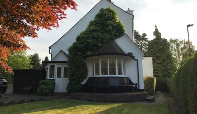 Picture of the Old Farm Hotel taken from outside in their private garden.