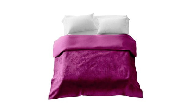 A double bed with two white pillow cases and a large dark pink weighted blanket laying on top