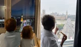 Three children looking out the window at London's Big Ben