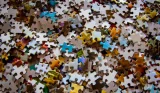 Scattered jigsaw puzzle pieces