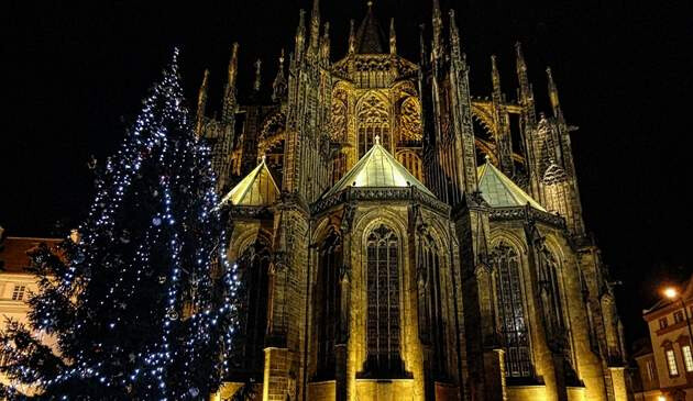 Famous Prague architecture with Christmas tree beside