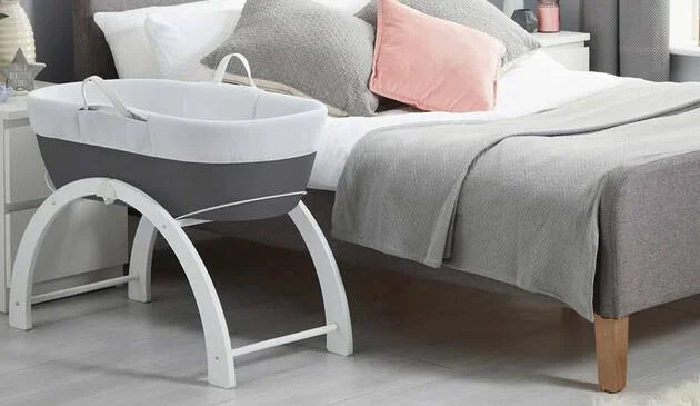 Shnuggle dreami clever sleeper set up next to bed