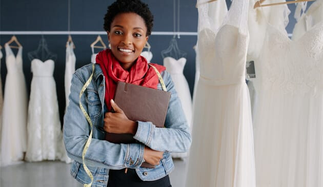 woman working in wedding dress shop