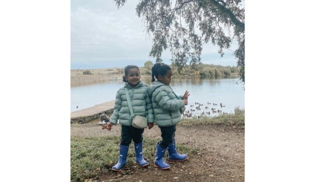 two children in padded parka coats