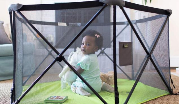 Child in Summer Infant Pop N Play playpen