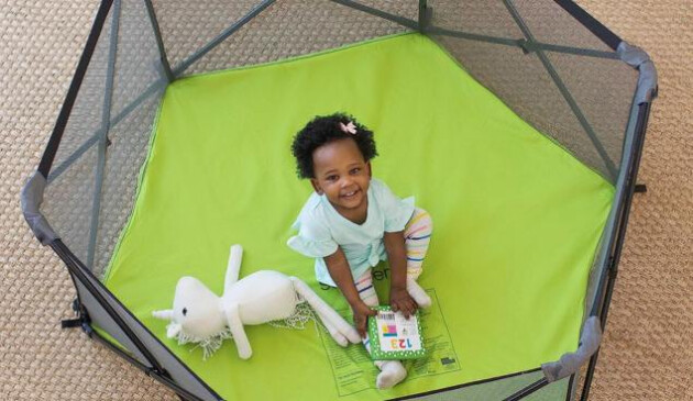 Child playing with stuffed toy in Summer Infant playpen