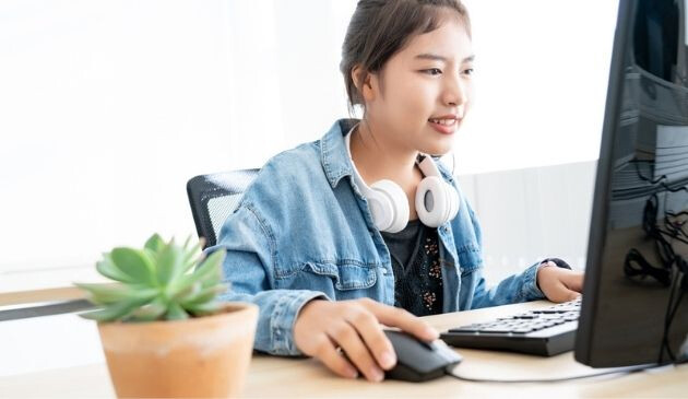 teenager learning on computer