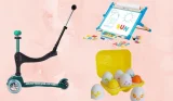A pale pink background with a Micro Scooter, Toonies eggs and a Melissa and Doug easel