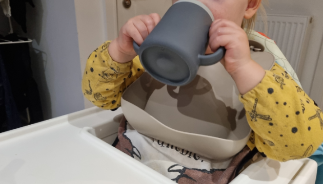 Toddler drinking from Tum Tum 3 Way Trainer Cup
