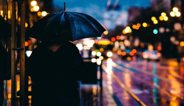 Woman with an umbrella on the streets of London