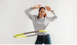 Woman using a weighted hula hoop