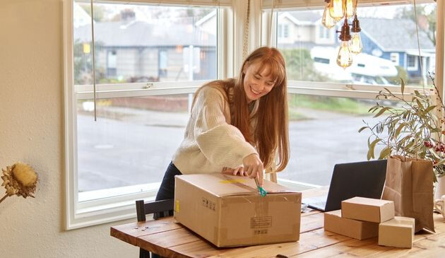 Woman opening box