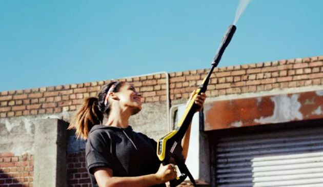 Woman with a pressure washer