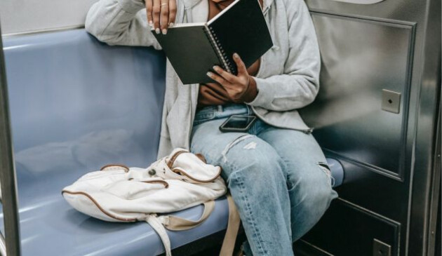 Woman with a notepad on train