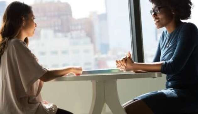 Two women talking