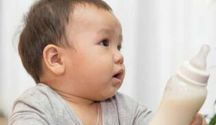 child reach bottle milk